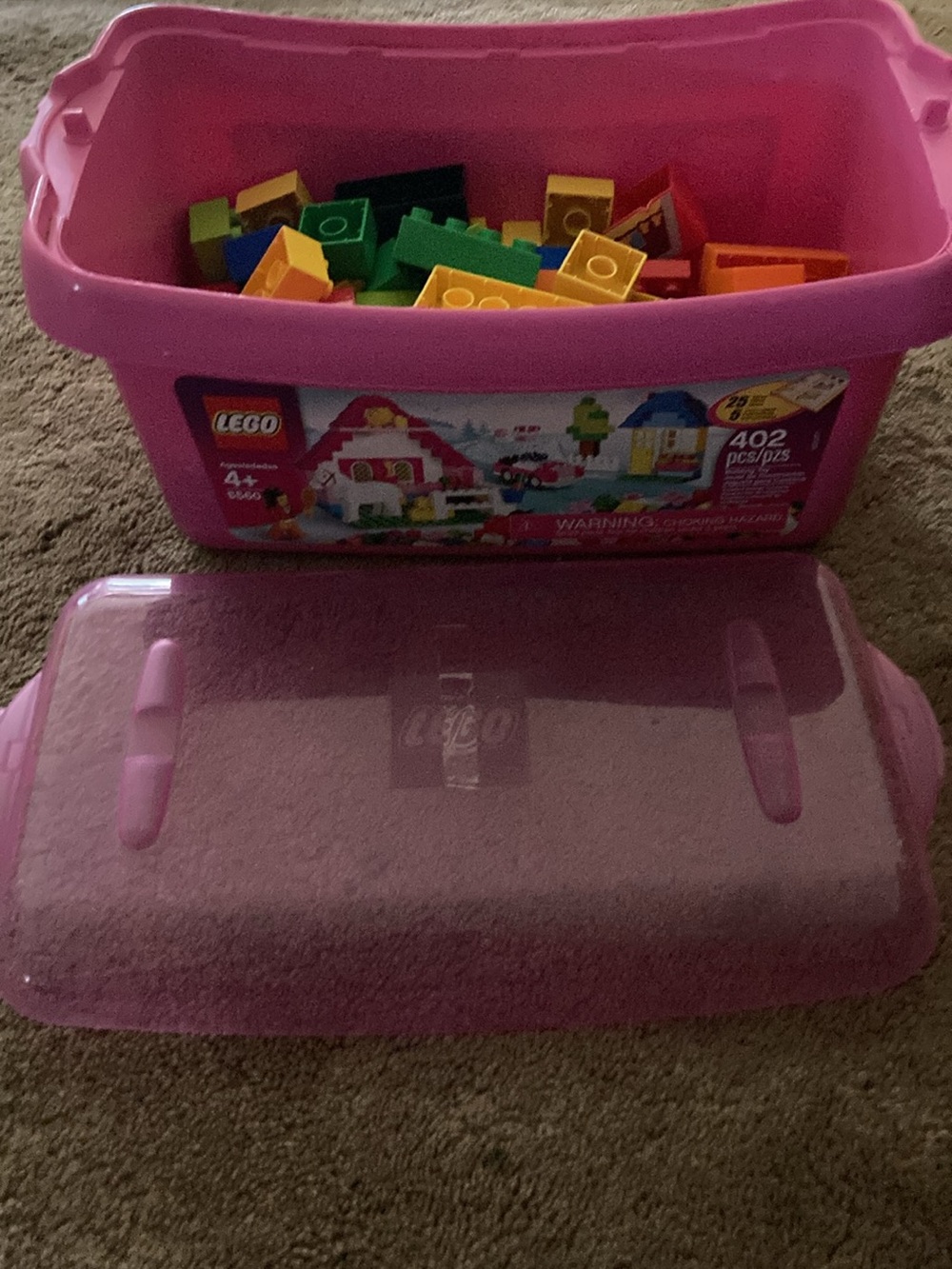 Lego Pink Storage Bin with Multicolor Lego blocks .